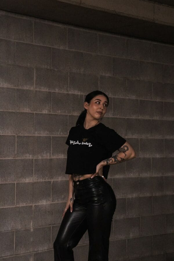 Female wearing a DSK Crop Tee