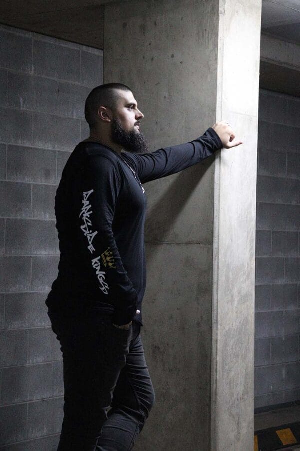 Male wearing a long sleeve DSK shirt