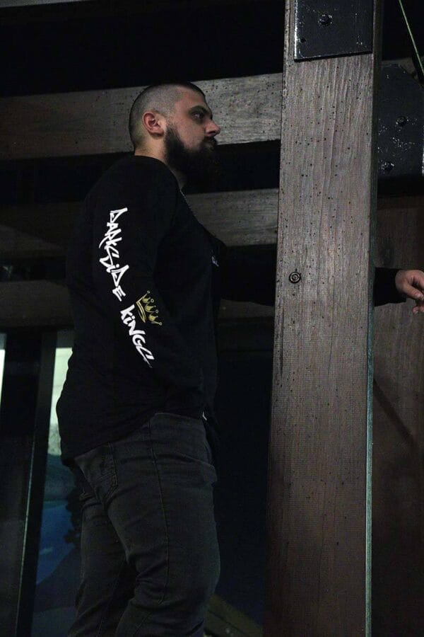 Male wearing a long sleeve DSK shirt