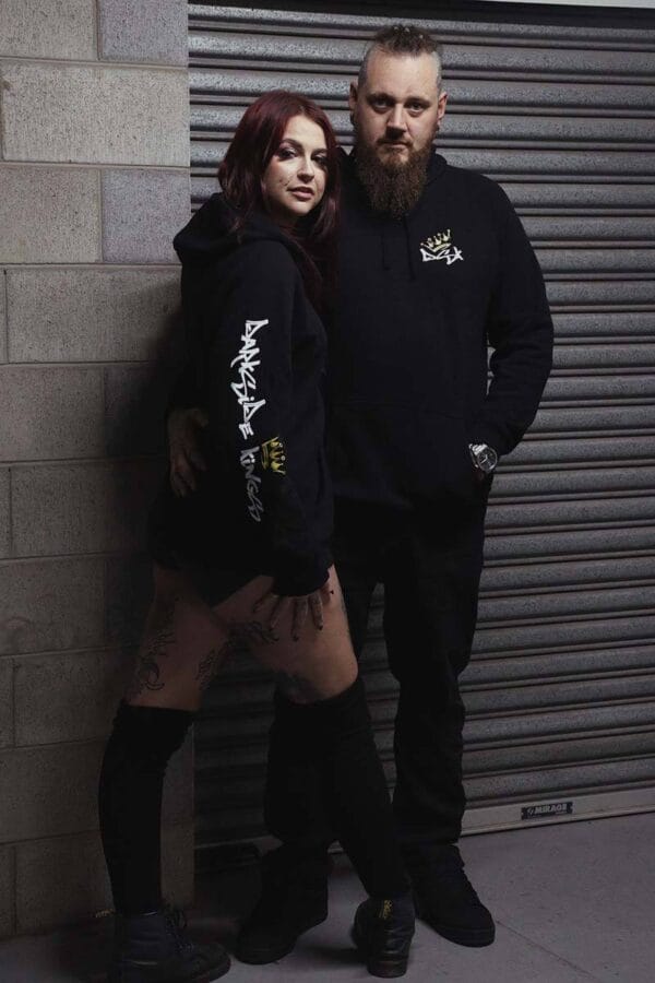Male and female wearing DSK Hoodies