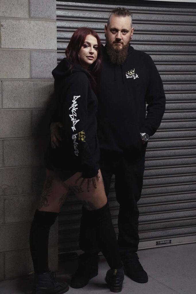 Male and female wearing DSK Hoodies