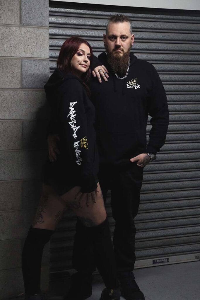 Male and female wearing DSK Hoodies
