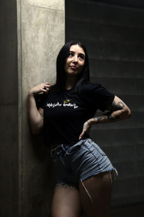 Female wearing a DSK Crop Tee