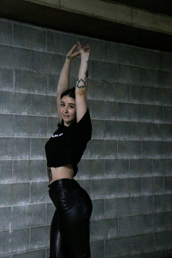 Female wearing a DSK Crop Tee