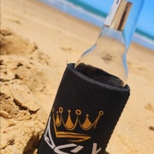 DSK Stubby Cooler on the sand at the beach