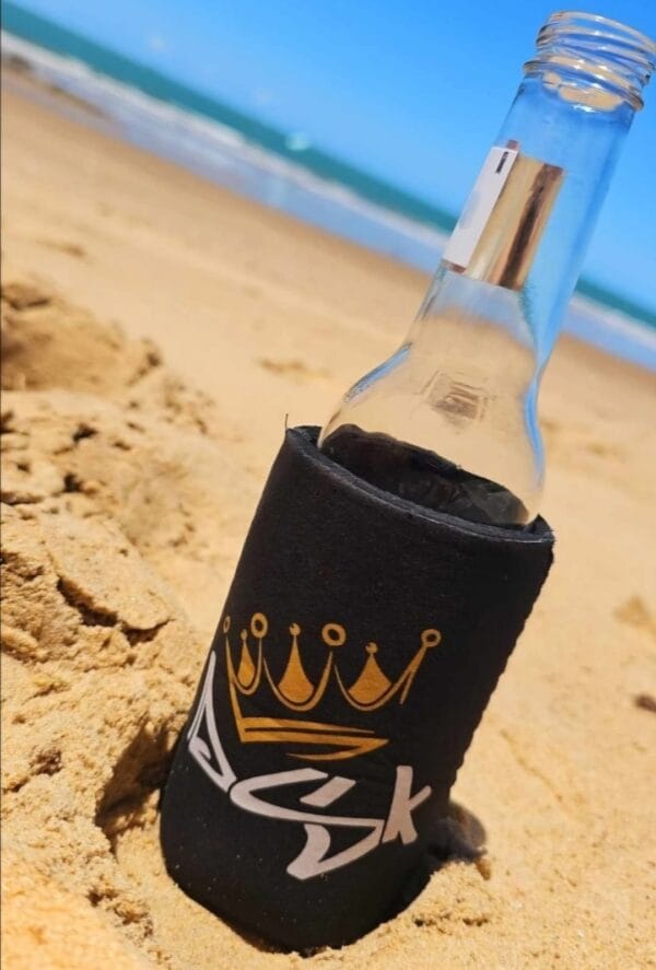 DSK Stubby Cooler on the sand at the beach
