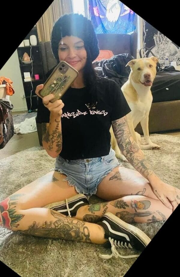 Customer wearing a DSK Crop T-shirt in front of a mirror