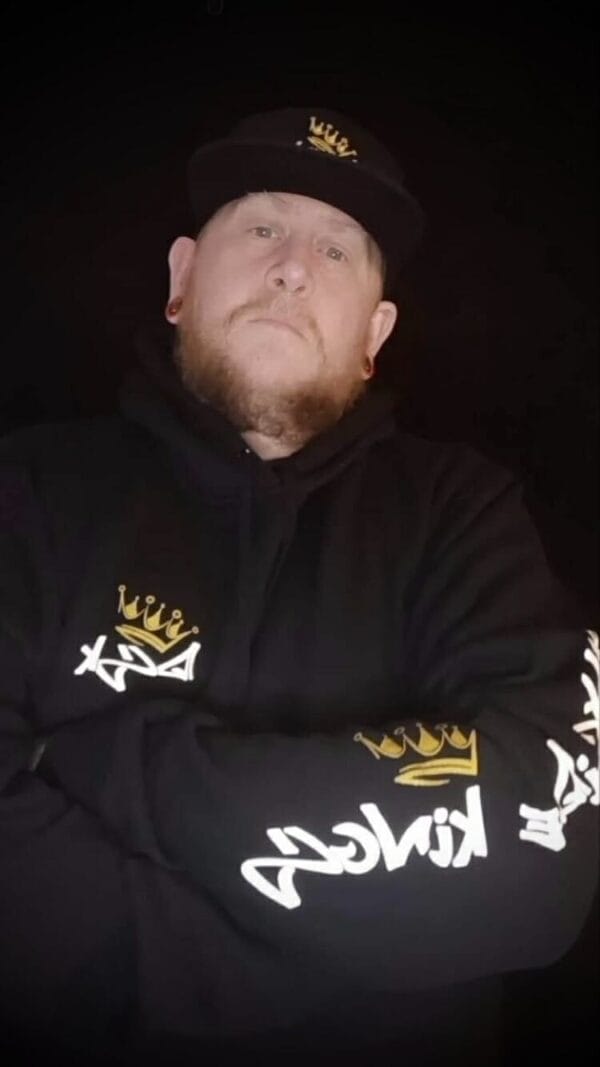 Male wearing a DSK Hoodie and Flat Brim Cap